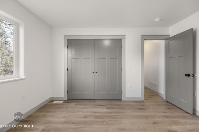 7177 N Paw St, Wasilla, AK 99654 - unfurnished bedroom with visible vents, baseboards, and multiple windows