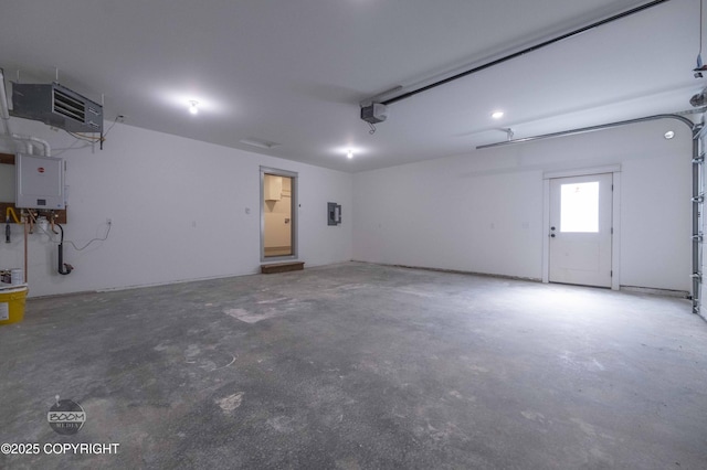7177 N Paw St, Wasilla, AK 99654 - garage with a garage door opener, water heater, and electric panel