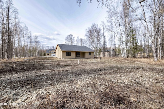 7177 N Paw St, Wasilla, AK 99654 - exterior space with stucco siding