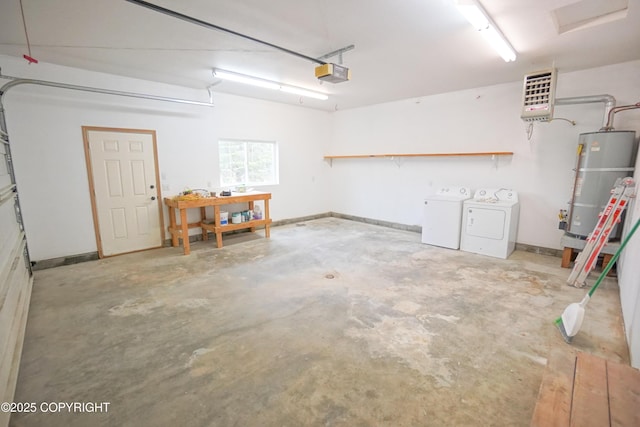 garage with washer and clothes dryer, strapped water heater, and a garage door opener