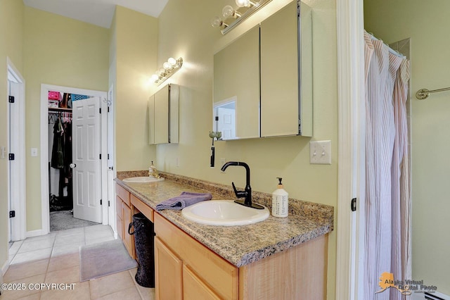 3541 E Wanamingo Dr, Wasilla, AK 99654 - bathroom with a sink, tile patterned flooring, a spacious closet, and double vanity