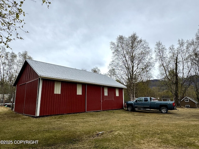 view of pole building with a yard