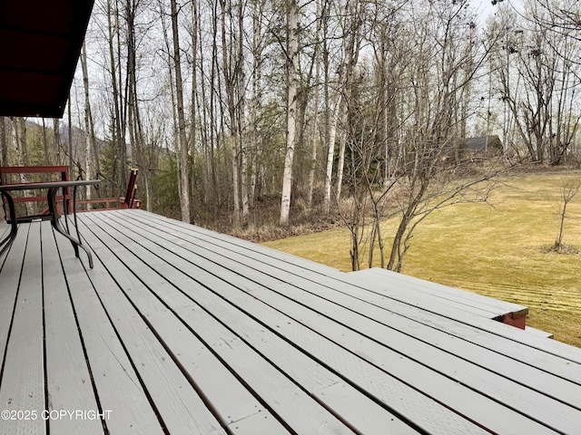 wooden deck with a yard