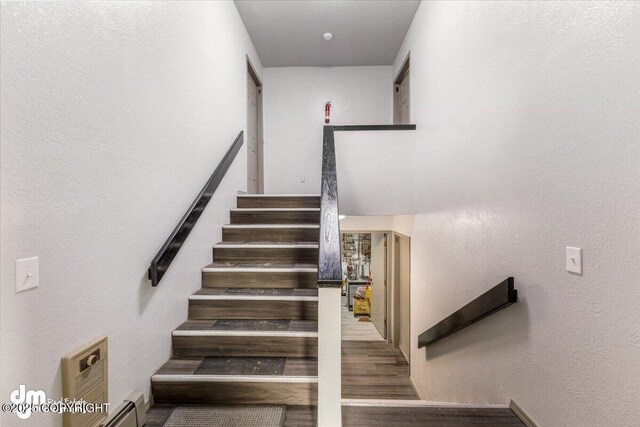 2601 E Quiet Cir, Wasilla, AK 99654 - stairs with a textured wall and wood finished floors