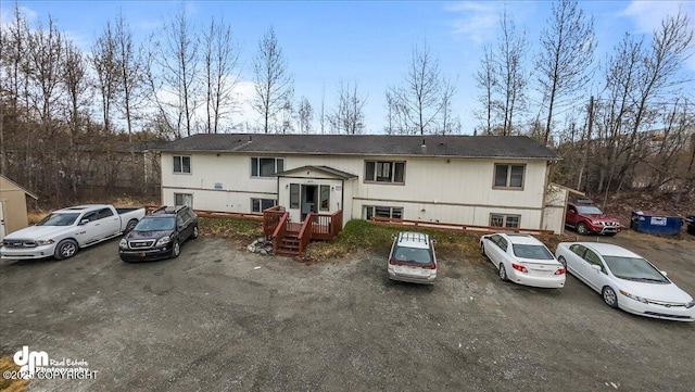 2601 E Quiet Cir, Wasilla, AK 99654 - view of front of property featuring a wooden deck and uncovered parking