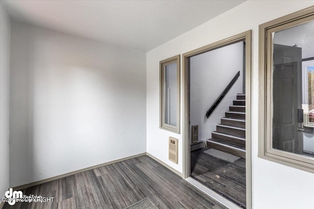 2601 E Quiet Cir, Wasilla, AK 99654 - interior space with baseboards, a baseboard radiator, and wood finished floors