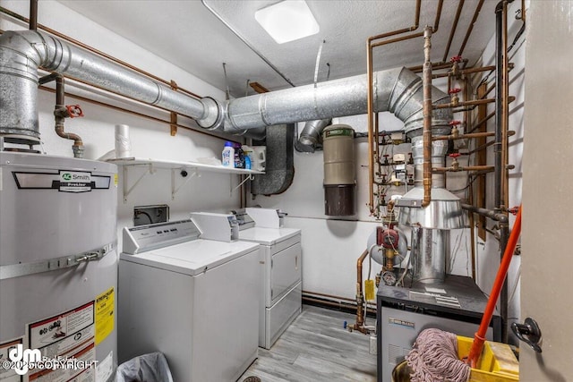2601 E Quiet Cir, Wasilla, AK 99654 - clothes washing area with washer and dryer, laundry area, light wood finished floors, and water heater