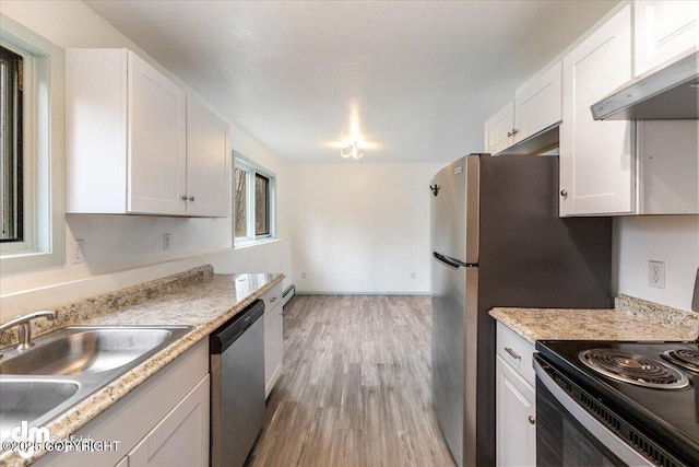 2601 E Quiet Cir, Wasilla, AK 99654 - kitchen with white cabinets, a sink, black electric range, light wood-style flooring, and stainless steel dishwasher