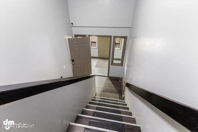 2601 E Quiet Cir, Wasilla, AK 99654 - stairs featuring a textured wall and wood finished floors