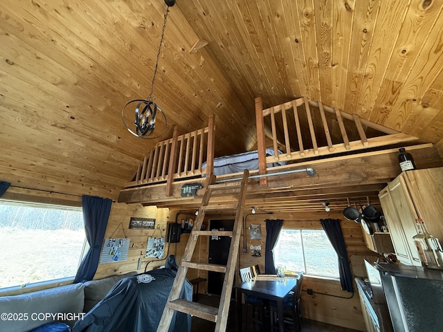 bedroom featuring wooden ceiling, wood walls, and high vaulted ceiling