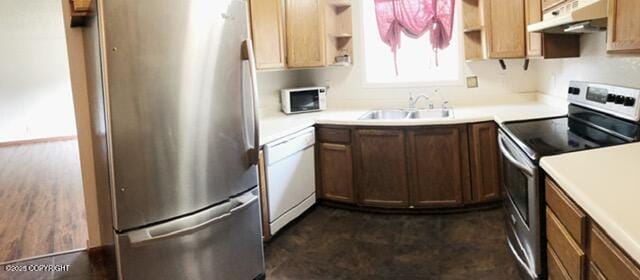kitchen with a sink, stainless steel appliances, open shelves, and under cabinet range hood