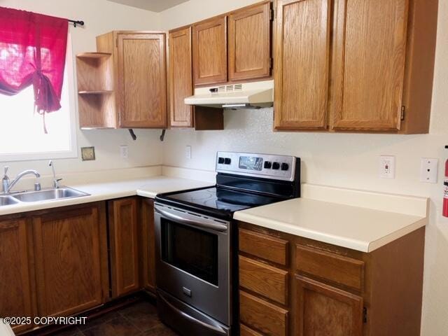 kitchen with a sink, under cabinet range hood, open shelves, light countertops, and stainless steel electric stove