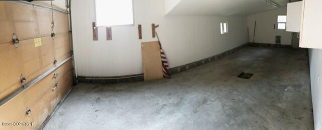 additional living space featuring concrete floors