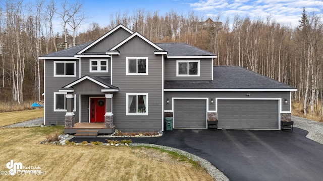 view of front of property with a garage, aphalt driveway, roof with shingles, and stone siding
