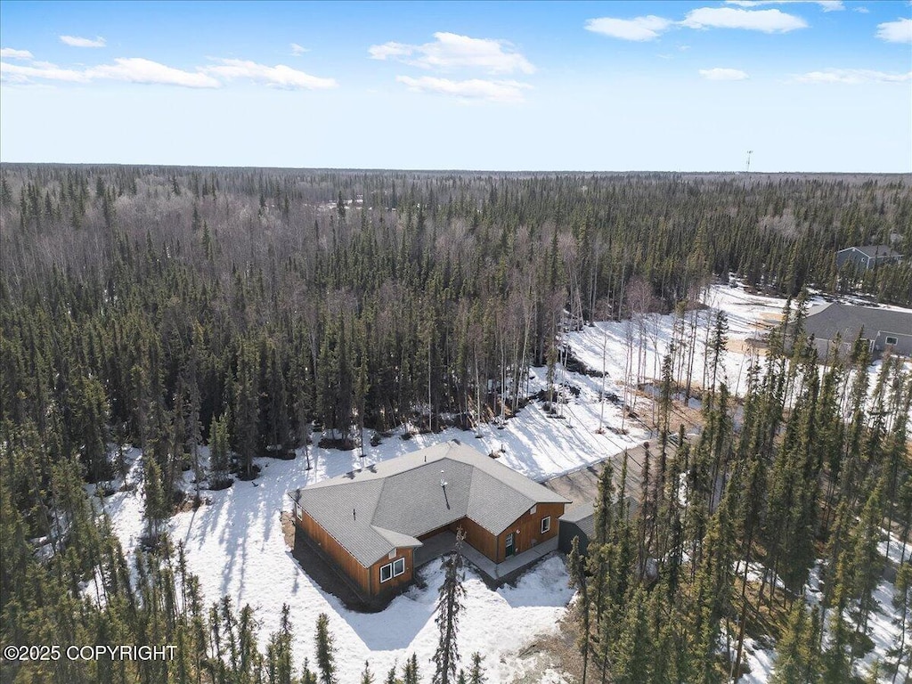 snowy aerial view with a view of trees