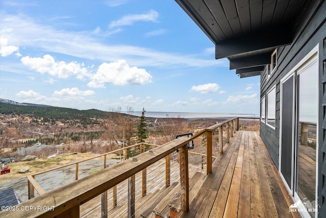 wooden deck with a mountain view