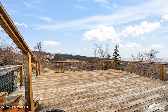 wooden terrace with a mountain view