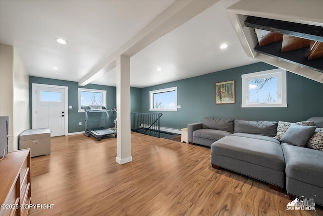 living area with recessed lighting, baseboards, and light wood finished floors