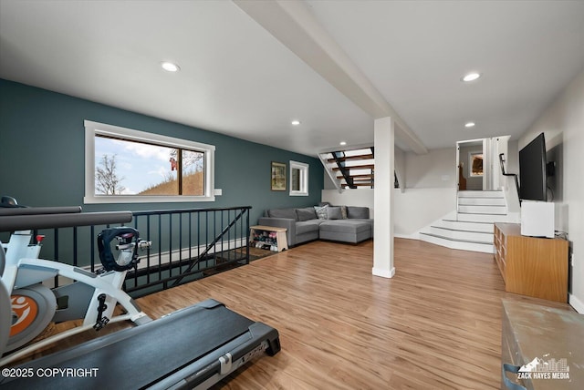 exercise room with baseboards, recessed lighting, and wood finished floors