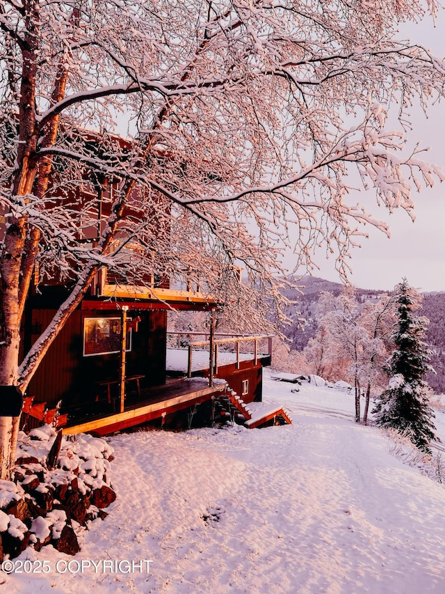 snow covered property with a mountain view