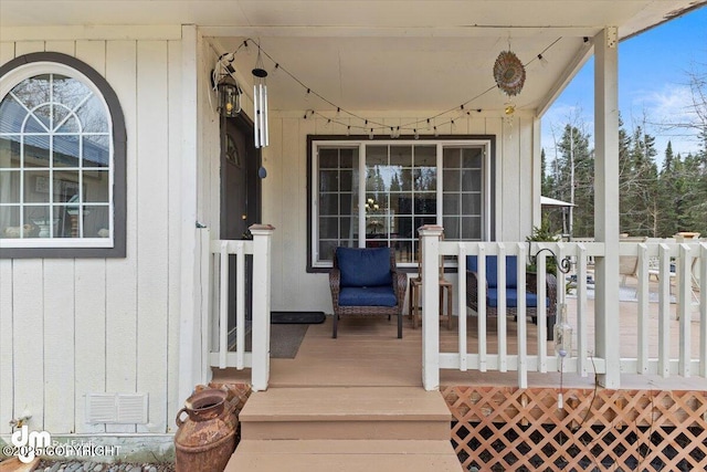 entrance to property featuring visible vents and a porch