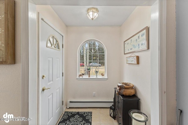 doorway featuring tile patterned floors, baseboards, and a baseboard heating unit