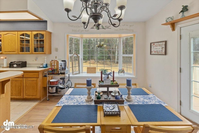 dining space featuring a chandelier and light wood-type flooring