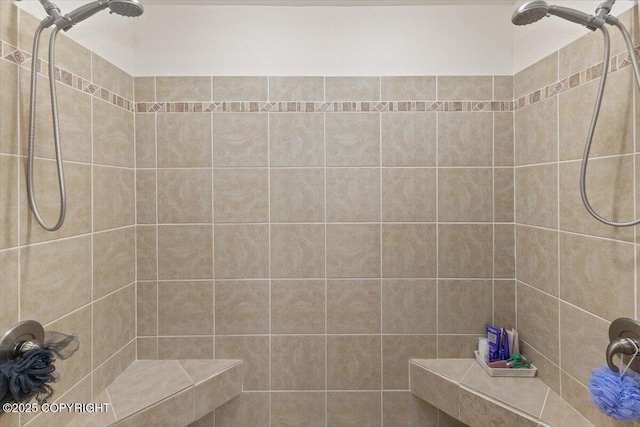 full bath with tiled shower