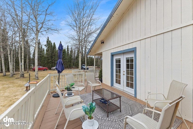 deck with outdoor lounge area and french doors