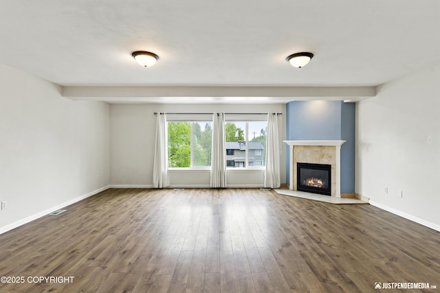 243 Creekside St # 2, Anchorage, AK 99504 - unfurnished living room featuring wood finished floors, a tile fireplace, and baseboards