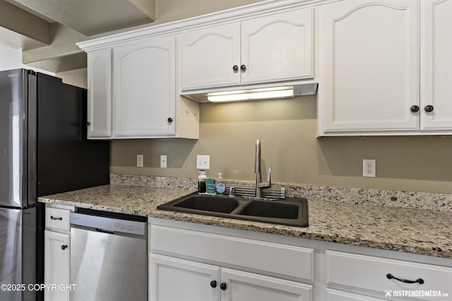 243 Creekside St # 2, Anchorage, AK 99504 - kitchen featuring appliances with stainless steel finishes, a sink, white cabinetry, and light stone counters