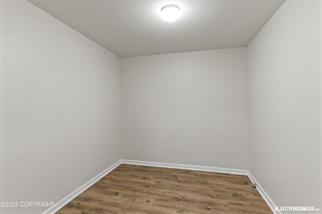 243 Creekside St # 2, Anchorage, AK 99504 - unfurnished room featuring wood finished floors and baseboards
