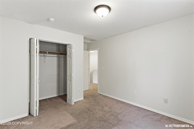 243 Creekside St # 2, Anchorage, AK 99504 - unfurnished bedroom featuring carpet floors, a closet, and baseboards