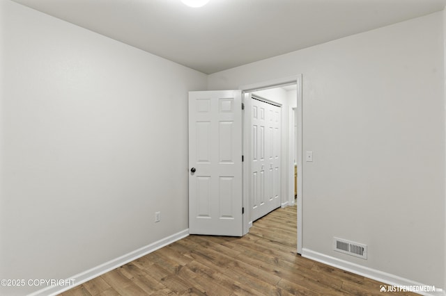 243 Creekside St # 2, Anchorage, AK 99504 - unfurnished room with baseboards and wood finished floors