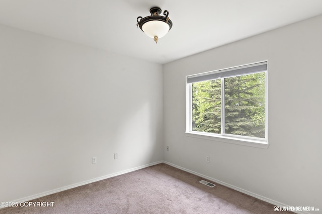 243 Creekside St # 2, Anchorage, AK 99504 - carpeted empty room with baseboards