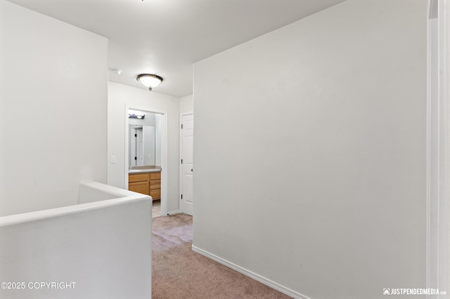 243 Creekside St # 2, Anchorage, AK 99504 - hallway with light colored carpet and baseboards