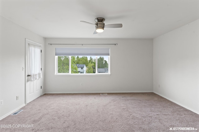 243 Creekside St # 2, Anchorage, AK 99504 - carpeted spare room featuring ceiling fan and baseboards