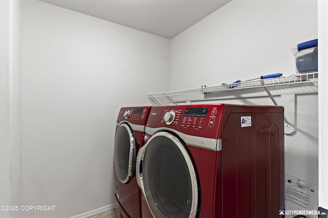 243 Creekside St # 2, Anchorage, AK 99504 - laundry room featuring washer and clothes dryer and baseboards