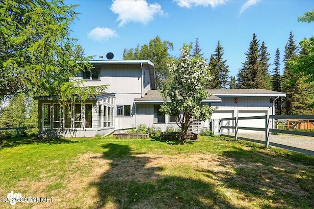 25925 Williamson Ln, Kasilof, AK 99610 - rear view of house featuring a garage and driveway