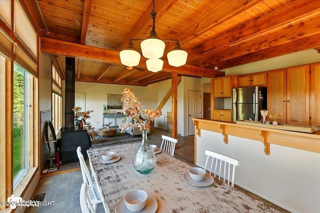 25925 Williamson Ln, Kasilof, AK 99610 - dining room featuring a wooden ceiling with exposed beams and a chandelier