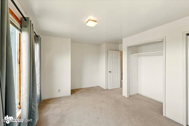 25925 Williamson Ln, Kasilof, AK 99610 - unfurnished bedroom featuring light carpet and a closet