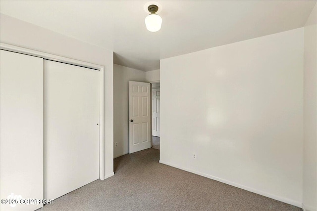 25925 Williamson Ln, Kasilof, AK 99610 - unfurnished bedroom featuring carpet flooring and a closet
