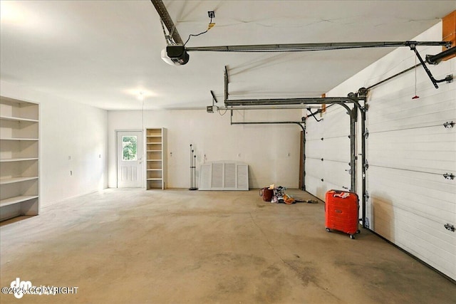 25925 Williamson Ln, Kasilof, AK 99610 - garage featuring a garage door opener