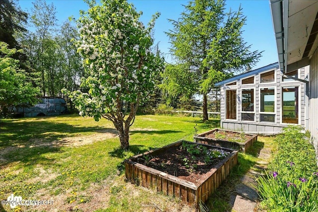 25925 Williamson Ln, Kasilof, AK 99610 - view of green lawn with a vegetable garden