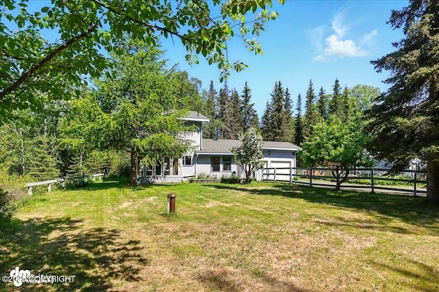 25925 Williamson Ln, Kasilof, AK 99610 - view of yard featuring an attached garage