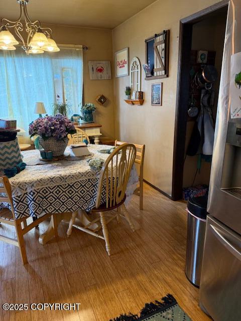 1217 Madsen Ave, Kodiak, AK 99615 - dining room with light wood-type flooring and a chandelier