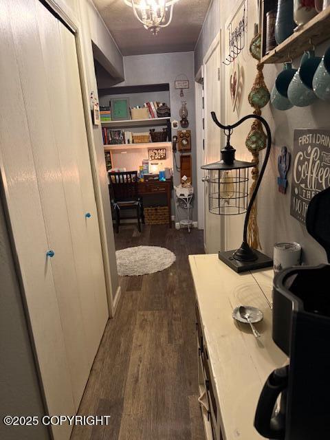 1217 Madsen Ave, Kodiak, AK 99615 - hallway featuring a chandelier and dark wood-style floors