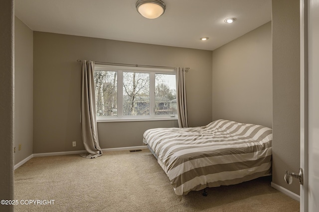 bedroom featuring carpet floors, baseboards, and visible vents