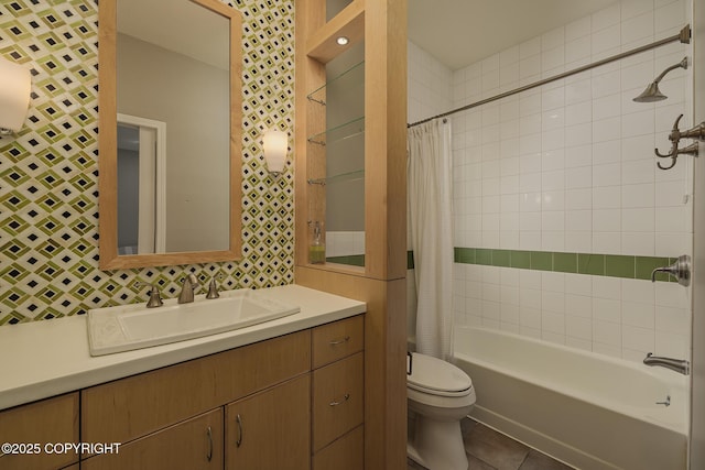 bathroom with vanity, tile patterned flooring, shower / bath combo, and toilet