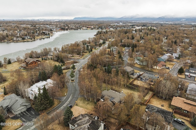 drone / aerial view with a residential view and a water view